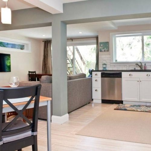 High-end hot dual plate and convection oven, custom cabinets, granite counter top, dishwasher, and Keurig coffee machine with free coffee.