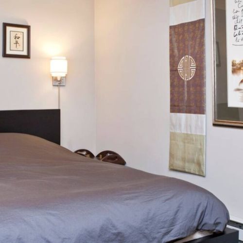 Bedroom includes queen size bed, dresser, night tables, and closet.
