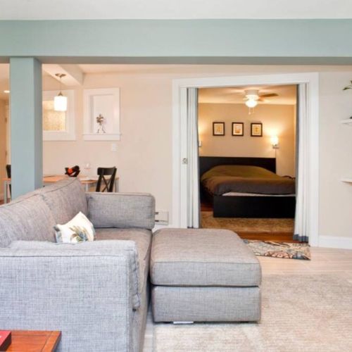 Living room area with a view of the bedroom.