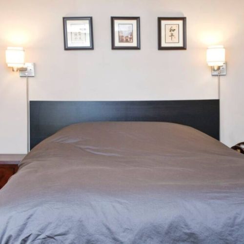 Bedroom includes queen size bed, dresser, night tables, and closet.